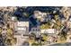 Aerial of a custom home with a private pool, sprawling grounds, desert landscaping, and scenic mountain views at 10638 E Hedgehog Pl, Scottsdale, AZ 85262