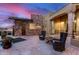 Private backyard features a unique pool, stone accents, and comfortable seating, perfect for relaxation and outdoor enjoyment at 10638 E Hedgehog Pl, Scottsdale, AZ 85262