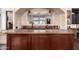 Close up of the stylish bar area with copper countertops and a mirrored backsplash at 10638 E Hedgehog Pl, Scottsdale, AZ 85262