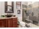 This bathroom features granite counters, bowl sink, toilet and a tiled walk-in shower with a built-in bench at 10638 E Hedgehog Pl, Scottsdale, AZ 85262