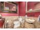 Powder room with stone accents, a unique bowl sink, and decorative mirrors at 10638 E Hedgehog Pl, Scottsdale, AZ 85262