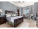 Relaxing bedroom features a queen bed, neutral colors, and a window with natural light at 10638 E Hedgehog Pl, Scottsdale, AZ 85262