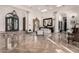 Grand foyer with marble flooring, ornate double doors, and elegant chandelier, creating a luxurious and welcoming entrance at 10638 E Hedgehog Pl, Scottsdale, AZ 85262