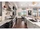 Gourmet kitchen features a stainless steel range, granite countertops, and designer fixtures at 10638 E Hedgehog Pl, Scottsdale, AZ 85262