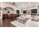 Spacious living room featuring an open layout, seamless access to the kitchen and modern decor at 10638 E Hedgehog Pl, Scottsdale, AZ 85262