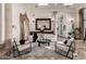 Bright living room with marble floors, large windows, and stylish furniture, creating a comfortable and inviting space at 10638 E Hedgehog Pl, Scottsdale, AZ 85262