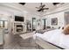 A large primary bedroom featuring a fireplace, patio access, and ensuite bath at 10638 E Hedgehog Pl, Scottsdale, AZ 85262