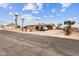 Inviting home exterior with a well-maintained yard, driveway, and a basketball hoop on the side at 10745 N Arapaho Dr, Casa Grande, AZ 85122