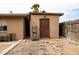 Tan storage shed with a brown door, providing additional storage space on the property at 10745 N Arapaho Dr, Casa Grande, AZ 85122