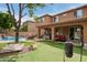 Backyard with pool, patio, and grass at 1152 W Horseshoe Ave, Gilbert, AZ 85233