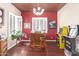 Entertainment area with a full wet bar, seating, and vintage arcade games for a fun and unique home experience at 1152 W Horseshoe Ave, Gilbert, AZ 85233