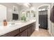 Bathroom featuring double sinks, and a framed mirror at 1152 W Horseshoe Ave, Gilbert, AZ 85233