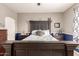 Bedroom featuring dark wood furniture, decorative accents, and a calming aesthetic at 1152 W Horseshoe Ave, Gilbert, AZ 85233