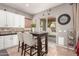 Eat in Kitchen has white cabinets, granite countertop and backsplash. Patio access for outdoor enjoyment at 1152 W Horseshoe Ave, Gilbert, AZ 85233
