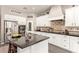 Spacious kitchen features white cabinets, granite counters, and a large island, perfect for cooking and entertaining at 1152 W Horseshoe Ave, Gilbert, AZ 85233