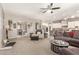 Spacious living area flows into the open concept kitchen and features a ceiling fan at 1152 W Horseshoe Ave, Gilbert, AZ 85233