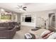 Inviting living room with built-in shelving, plush seating, and lots of natural light at 1152 W Horseshoe Ave, Gilbert, AZ 85233