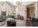 This office is stylishly designed with hardwood flooring, arched windows, and elegant chandelier at 1152 W Horseshoe Ave, Gilbert, AZ 85233