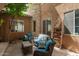 Comfortable outdoor seating area with a cozy vibe featuring string lights and a mature shade tree at 1152 W Horseshoe Ave, Gilbert, AZ 85233
