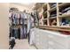 Walk-in closet with shelving and rods for ample storage and organization at 1152 W Horseshoe Ave, Gilbert, AZ 85233
