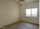 Bright bedroom featuring a window with blinds and neutral carpet at 14618 N 87Th Ave, Peoria, AZ 85381