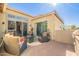 Outdoor patio featuring comfortable seating, a cozy fire pit, and a built-in grill, ideal for outdoor gatherings at 1488 E Sweet Citrus Dr, Queen Creek, AZ 85140