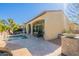 Beautiful backyard with a pool, lounge chairs, covered patio and well-manicured landscaping at 1488 E Sweet Citrus Dr, Queen Creek, AZ 85140
