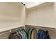 Spacious walk-in closet with built-in shelving and ample storage for organization and convenience at 1488 E Sweet Citrus Dr, Queen Creek, AZ 85140