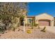 Charming single-story home with desert landscaping and a well-manicured front yard at 1488 E Sweet Citrus Dr, Queen Creek, AZ 85140