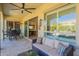 Charming covered patio with a ceiling fan, comfortable sofa, and open access to the living space at 1488 E Sweet Citrus Dr, Queen Creek, AZ 85140