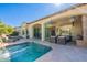 Back patio and pool with covered sitting area with lots of shade at 1488 E Sweet Citrus Dr, Queen Creek, AZ 85140