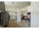 Spacious walk-in closet with built-in shelving and ample storage space for clothing and accessories at 1488 E Sweet Citrus Dr, Queen Creek, AZ 85140