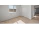 Bedroom featuring neutral carpet and a bright window, along with a closet at 16505 N Comet Trl, Maricopa, AZ 85138