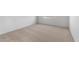 Minimalist bedroom featuring neutral carpet, white walls, and a bright window at 16505 N Comet Trl, Maricopa, AZ 85138