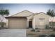 Charming single-story home features desert landscaping, a two-car garage, and a welcoming front entrance at 16505 N Comet Trl, Maricopa, AZ 85138