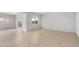 Bright, open-concept living room with tile flooring, and natural light at 16505 N Comet Trl, Maricopa, AZ 85138