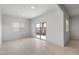 Bright living space with sliding glass doors, tile flooring, and recessed lighting at 16505 N Comet Trl, Maricopa, AZ 85138