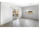 Bright, neutral bedroom with a sliding glass door to the outside at 16555 N Comet Trl, Maricopa, AZ 85138