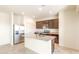 Bright kitchen featuring stainless steel appliances, granite countertops, and tile flooring at 16575 N Comet Trl, Maricopa, AZ 85138