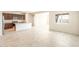 Bright kitchen with dark wood cabinets, granite countertops, stainless steel appliances, and an island with a breakfast bar at 16575 N Comet Trl, Maricopa, AZ 85138