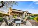 Inviting outdoor space featuring a fire pit and comfortable seating, perfect for entertaining guests in style at 17991 N 95Th St, Scottsdale, AZ 85255