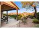 Private backyard with a covered patio, decorative landscaping, and stunning mountain views for a peaceful retreat at 17991 N 95Th St, Scottsdale, AZ 85255