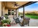 Comfortable covered patio with stylish furniture, a ceiling fan, and a glimpse of the picturesque mountain scenery at 17991 N 95Th St, Scottsdale, AZ 85255