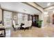 Bright dining room featuring seating for six, shuttered windows, and views of the living room at 17991 N 95Th St, Scottsdale, AZ 85255