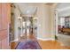 Welcoming foyer featuring tiled floors, arched doorways, decorative lighting, and elegant decor, creating a grand entrance at 17991 N 95Th St, Scottsdale, AZ 85255