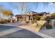 Attractive home featuring stone accents, desert landscaping, and a convenient circular driveway for easy access at 17991 N 95Th St, Scottsdale, AZ 85255