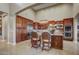 Gourmet kitchen with custom cabinetry, granite countertops, stainless steel appliances, and a spacious center island at 17991 N 95Th St, Scottsdale, AZ 85255