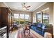 Inviting living room featuring comfortable seating, bright windows, and scenic views at 17991 N 95Th St, Scottsdale, AZ 85255