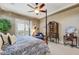 Primary bedroom with a king bed, furniture and bright natural light at 17991 N 95Th St, Scottsdale, AZ 85255