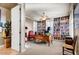 Bright office with floor to ceiling bookshelves, a ceiling fan and neutral tones at 17991 N 95Th St, Scottsdale, AZ 85255